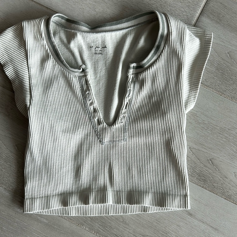 Ivory colors out from under crop top